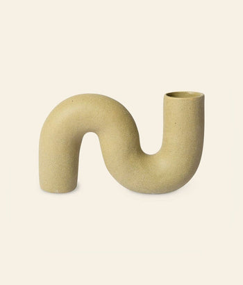 The HKliving HK Objects: Ceramic Twisted Vase by HKliving features a beige, S-shaped design with a matte finish and dual open ends, adding a sculptural, minimalist accent to your home decor.