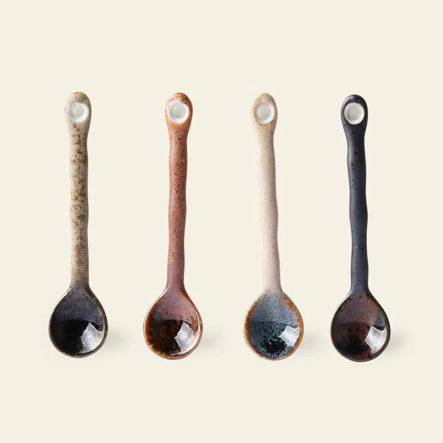 The HKLIVING Kyoto Ceramics Japanese Tea Spoons Set of 4 features glossy, dark bowls and wavy textured handles in green, brown, beige, and black, each with a hole at the end—reflecting Japanese craftsmanship.