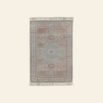 The HKLIVING Printed Indoor/Outdoor Rug (120x180) by HKLIVING features a handwoven pastel blue, pink, and beige pattern with intricate borders and fringe. Made from recycled PET bottles, it's eco-friendly and ideal for indoor or outdoor use.