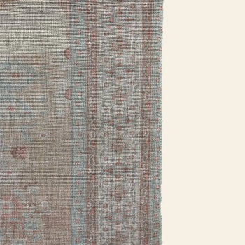 A close-up of the HKLIVING Printed Indoor/Outdoor Rug (120x180) shows its decorative border, muted beige, light blue, and faded red tones, and intricate edge patterns. Made by HKLIVING from recycled PET bottles for an eco-friendly touch.