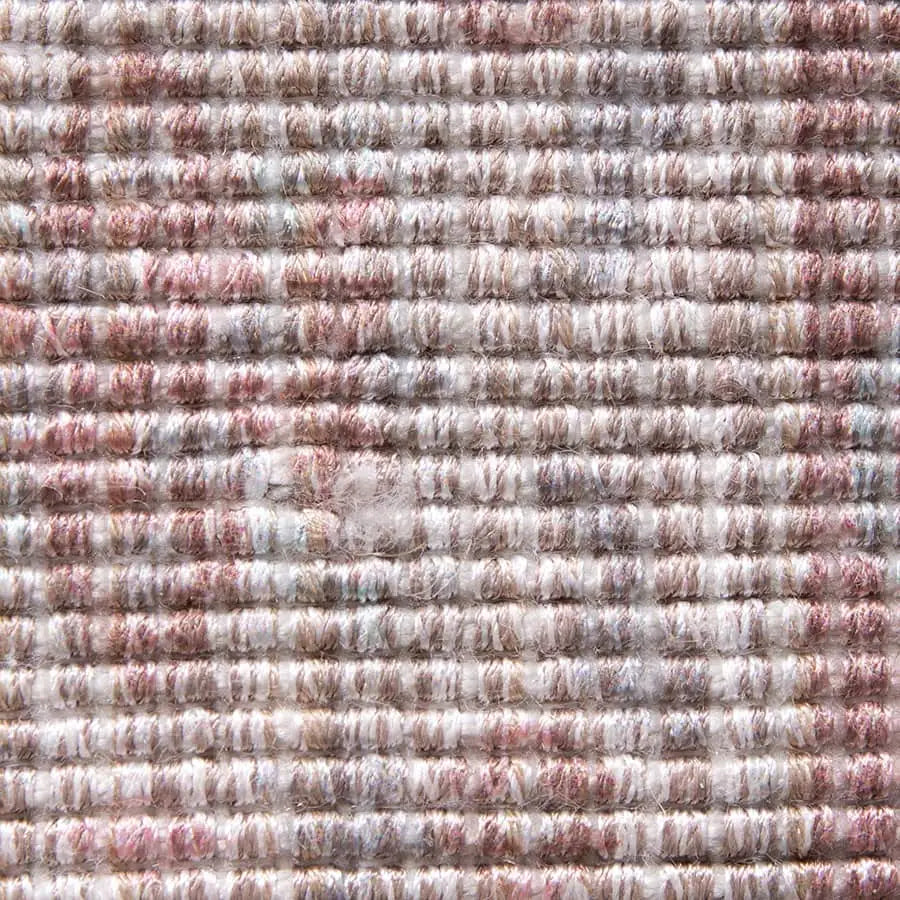 Close-up of the HKLIVING Printed Indoor/Outdoor Rug (120x180) shows textured, handwoven rows in muted pink, gray, and beige. A worn center row highlights its artisanal quality and eco-friendly design from recycled PET bottles by HKLIVING.