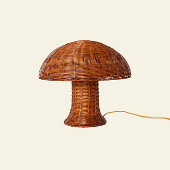 The HKLIVING Rattan Table Lamp by HKLIVING features a brown mushroom-shaped design with a wide top and cylindrical base, plus an electrical cord—ideal for bringing cozy lighting to any room.