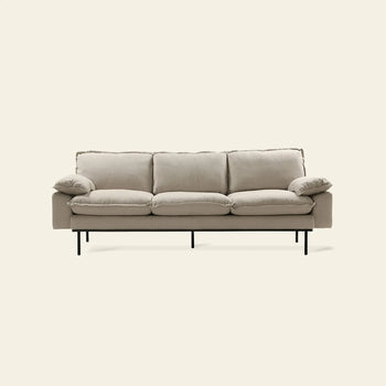 The HKLIVING Retro Sofa, 3-Seats by HKLIVING features a modern beige design with plush cushions and slim black metal legs, set against a plain light background.
