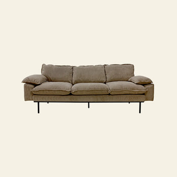 The HKLIVING Retro Sofa, 4-Seats features plush cushions and pillow-like armrests in a beige vintage style, supported by slim black metal legs and set against a plain light background.