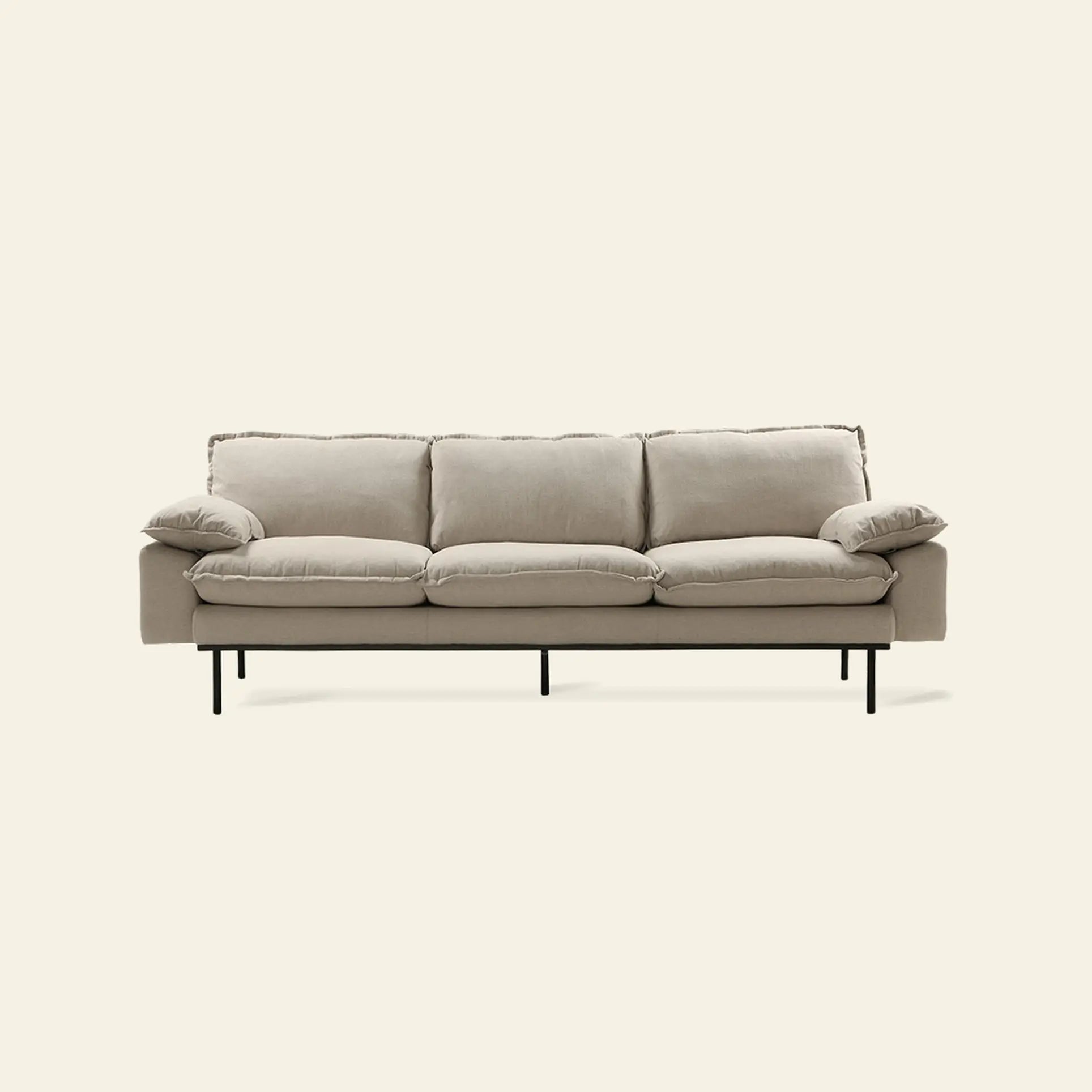The HKLIVING Retro Sofa, 4-Seats by HKLIVING features a modern light beige design with plush cushions, slim armrests, and black metal legs, showcased against a plain off-white background.
