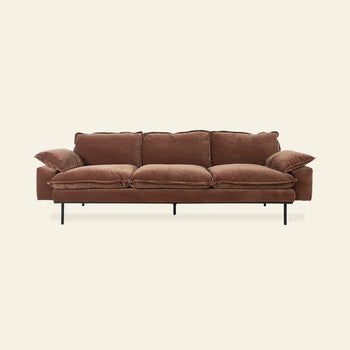 The HKLIVING Retro Sofa, 4-Seats, features brown velvet upholstery, three seat and back cushions, wide armrests, and slim black metal legs. It is displayed against a plain off-white background.