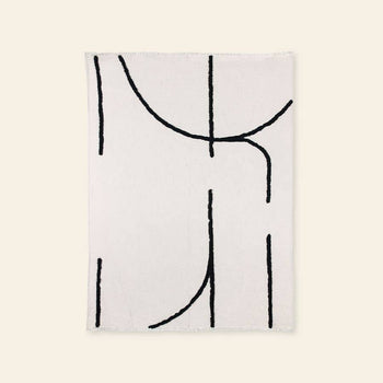 The HKliving Soft Woven Throw With Black Tufted Lines features minimalist black abstract lines on cosy cotton, adding stylish texture to any space. Crafted by HKliving, it perfectly complements modern interiors.