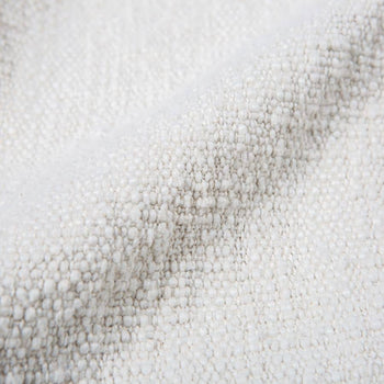 Close-up of the HKliving Soft Woven Throw With Black Tufted Lines by HKliving, featuring white textured fabric with gentle folds and soft appearance—ideal for adding stylish texture to your space.