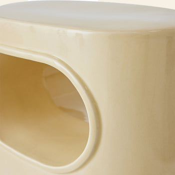 Close-up of the HKLIVING Space Side Table by HKLIVING, featuring a smooth, glossy beige ceramic finish with a rounded rectangular opening for built-in storage and a sleek modern, minimalist design—ideal for contemporary spaces.