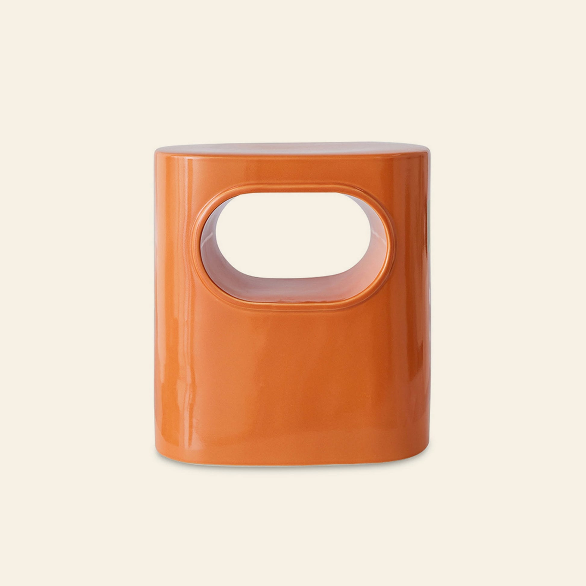 The HKLIVING Space Side Table by HKLIVING features a glossy orange ceramic finish, rounded rectangular shape, and large oval cutout—perfect as a modern accent piece—shown against a plain light background.