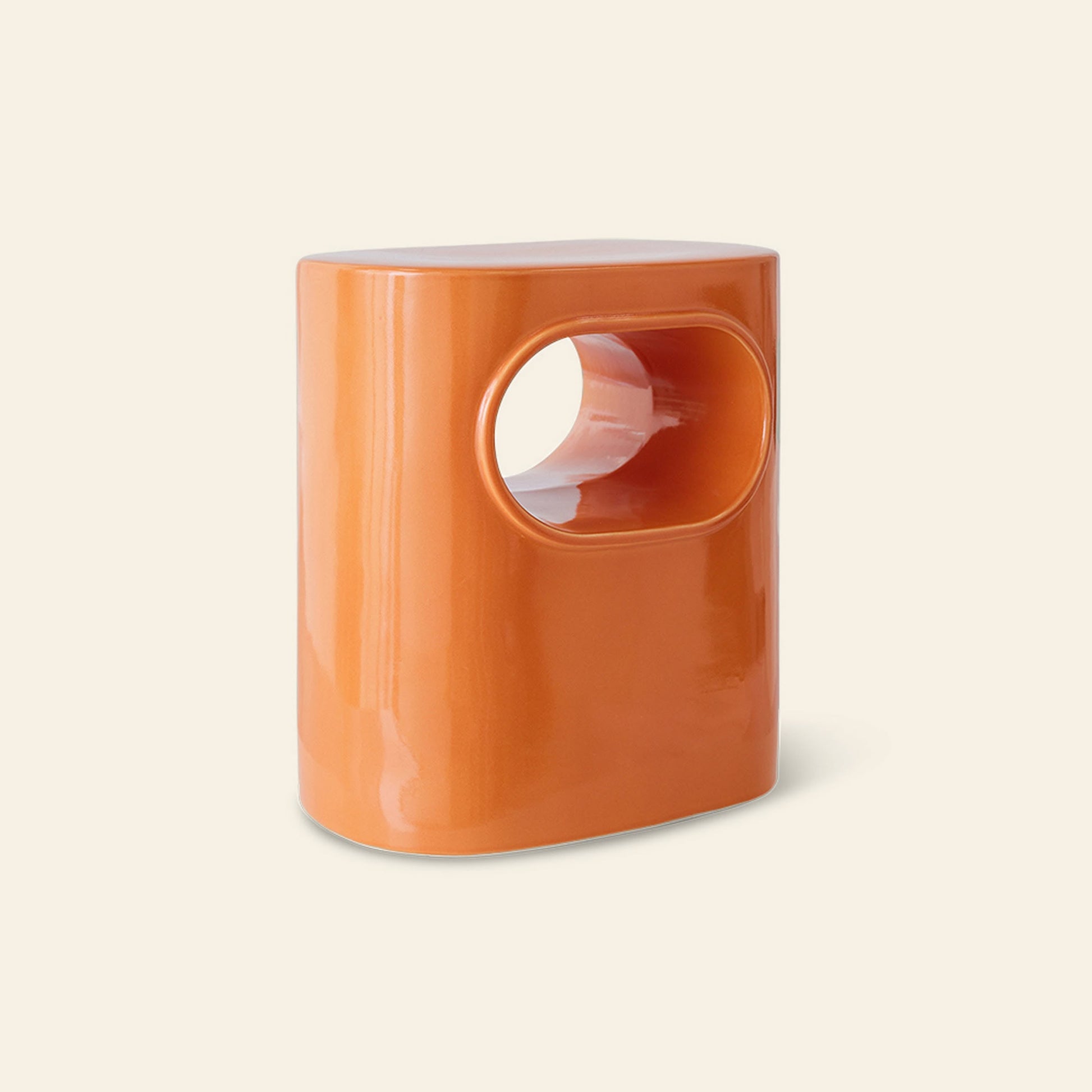 The HKLIVING Space Side Table by HKLIVING features a glossy orange ceramic oval design with a large center cutout, doubling as storage—perfect for modern living spaces and versatile as a side table on any neutral background.