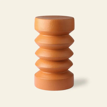 The HKLIVING Stoneware Side Table by HKLIVING features a brown sculptural design with a cylindrical form and three rounded grooves, resembling stacked discs, shown against a plain light background.