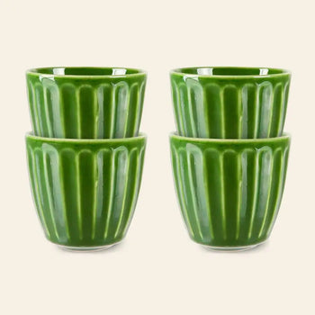 The HKliving The Emeralds: Ceramic Mug Ribbed set includes four green ceramic mugs stacked in pairs against a light background—a stylish addition to any coffee lover’s collection.