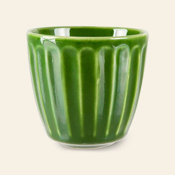 The HKliving The Emeralds: Ceramic Mug Ribbed, Set of 4 features small, glossy green ceramic mugs with a ribbed design and tapered base—ideal for coffee lovers and presented against a plain light background.