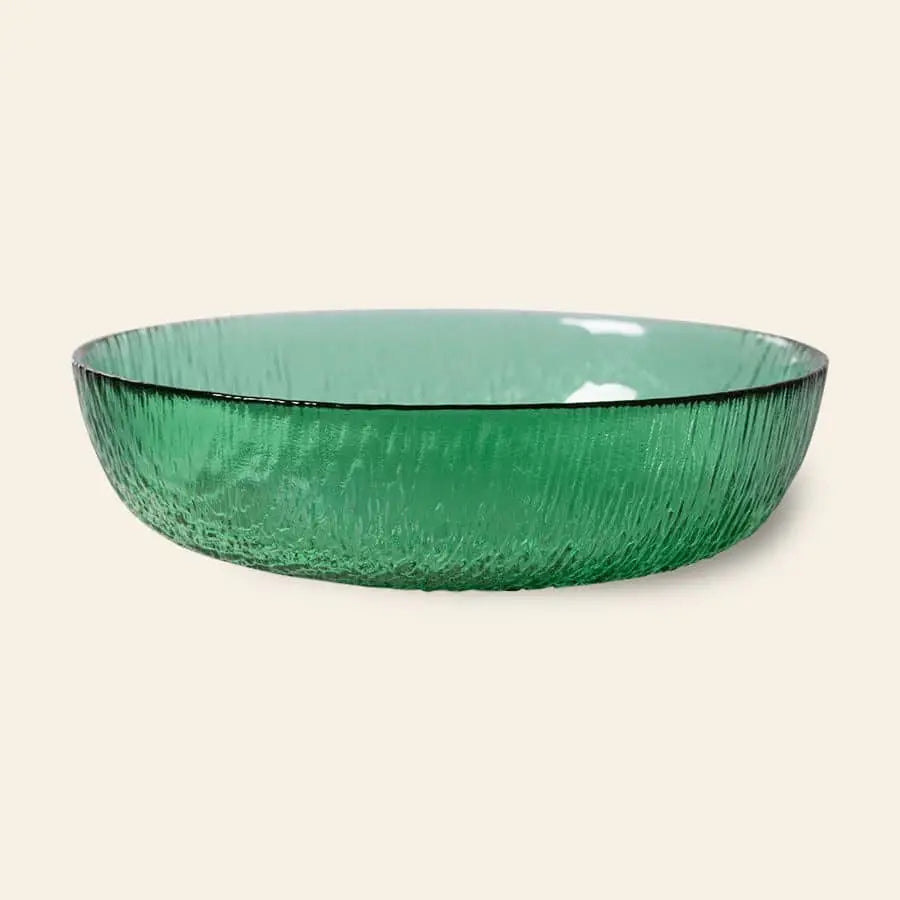 The HKliving The Emeralds: Glass Salad Bowl features round, textured emerald green glass with slightly flared edges, displayed against a plain beige background.