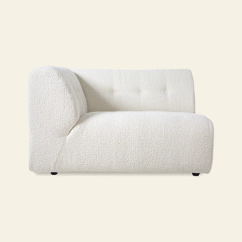 The HKLIVING Vint Couch, Left, 1.5-Seat is a modern armless sectional piece in textured white by HKLIVING. It has a curved backrest, minimalist lines, and customizable components for adaptable seating against a light background.