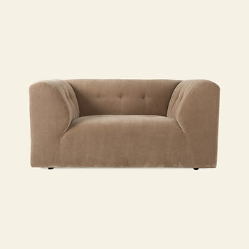 The HKLIVING Vint Couch, Loveseat by HKLIVING is a modern, light brown plush loveseat with rounded arms and a tufted backrest in soft fabric, shown against an off-white background.