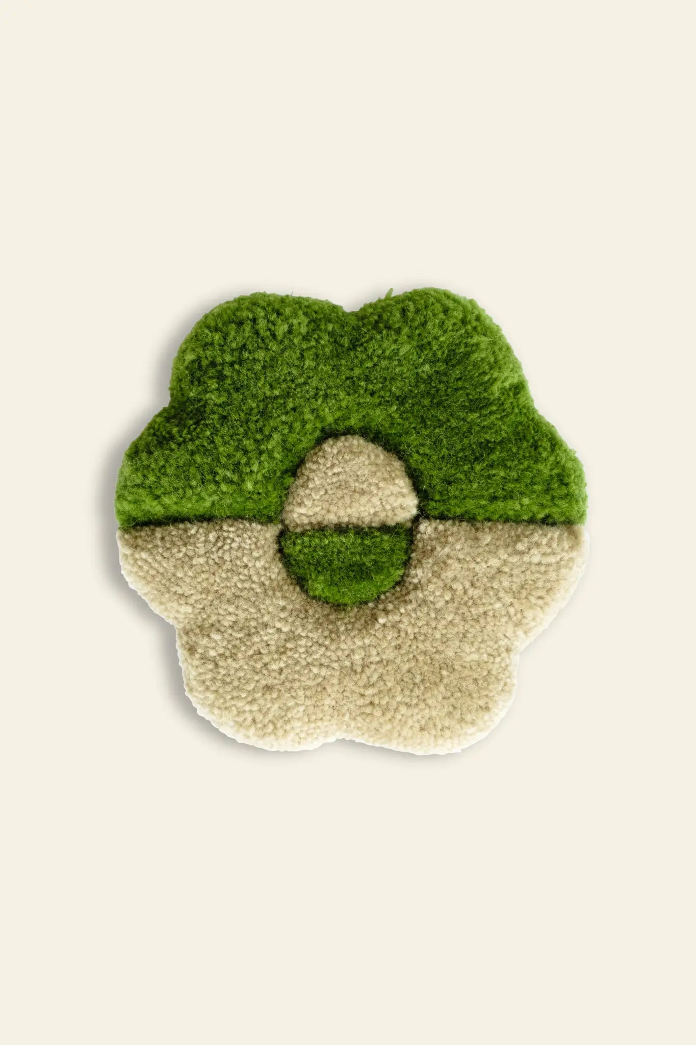 The Habichl Tufted Coasters by Habichl feature a fluffy, flower-shaped design in exclusive green and cream halves with a matching circular center, displayed on a plain light background.