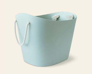 The Hachiman Balcolore Storage Basket M features a minimalist Japanese design in light blue with white rope handles, offering versatile storage from the Hachiman brand.