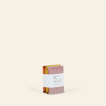 A set of three Hawkins New York Lurex Sponges, labeled with the brand name, is positioned in the center against a plain, light beige background.