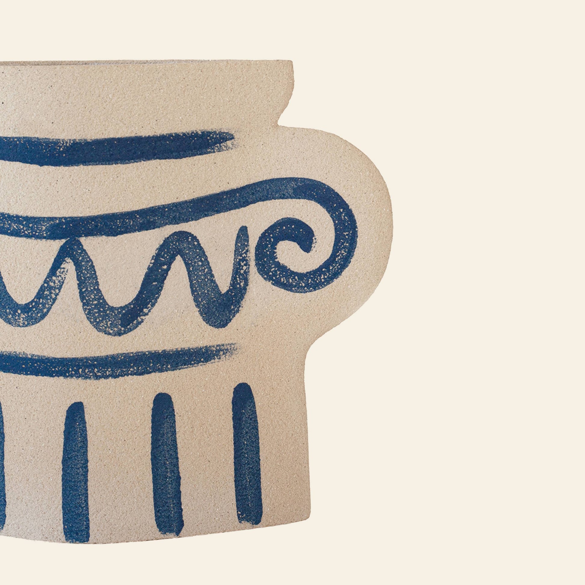 The photo shows only the right half of the INI CERAMIQUE Greek Column Ceramic Vase—a handcrafted, beige vase by INI CERAMIQUE with blue designs inspired by ancient Greek pottery—set against a light background.