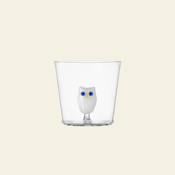 The Ichendorf Milano Animal Farm Tumbler by Ichendorf Milano features a small white owl with blue eyes at its base, displayed against a plain beige background.