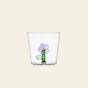 The Ichendorf Milano Botanica Tumbler - Lilac features a simple purple flower with green stem and leaves, adding nature-inspired charm from the Botanica collection by Ichendorf Milano to your table.