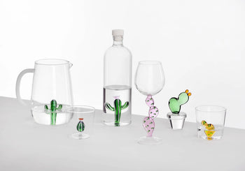 The Ichendorf Milano Desert Plants Bottle by Ichendorf Milano features delicate cactus-shaped decorations inside clear glass, bringing desert plant charm to your table.