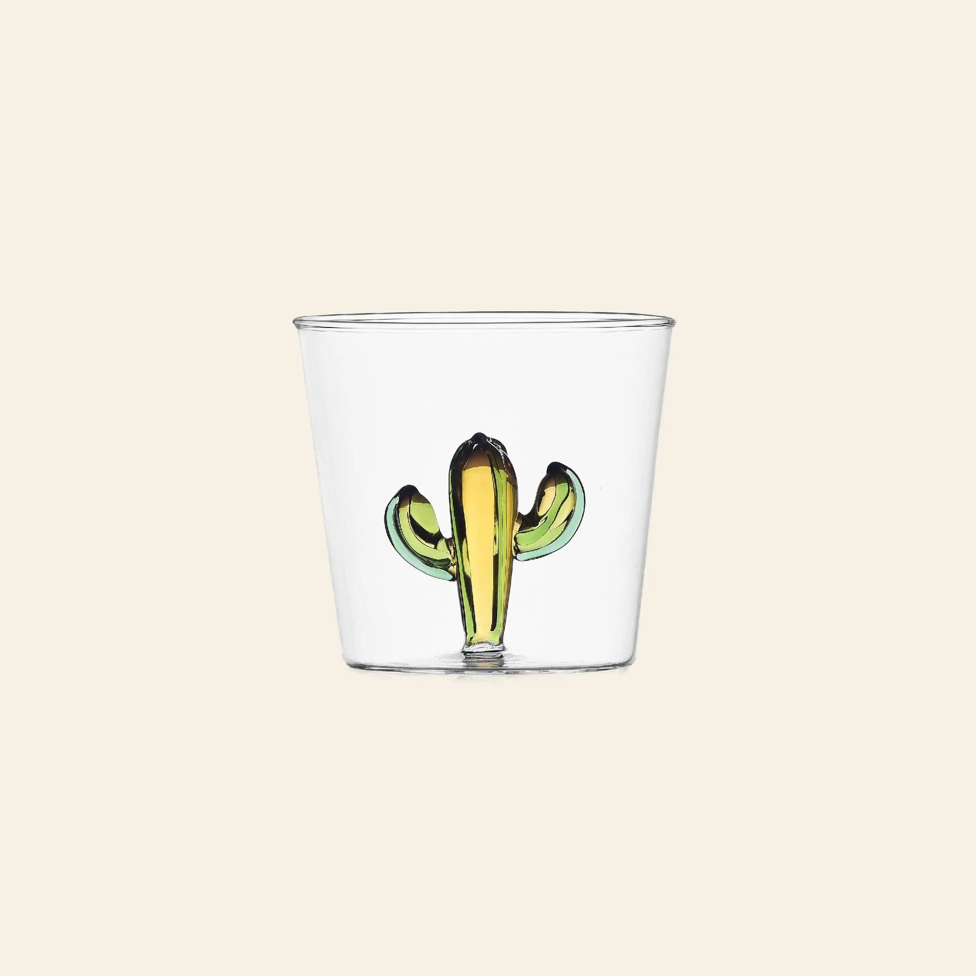 The Ichendorf Milano Desert Plants Tumbler by Ichendorf Milano features a small green and yellow cactus motif at the base, set against clear glass for a simple, elegant look.