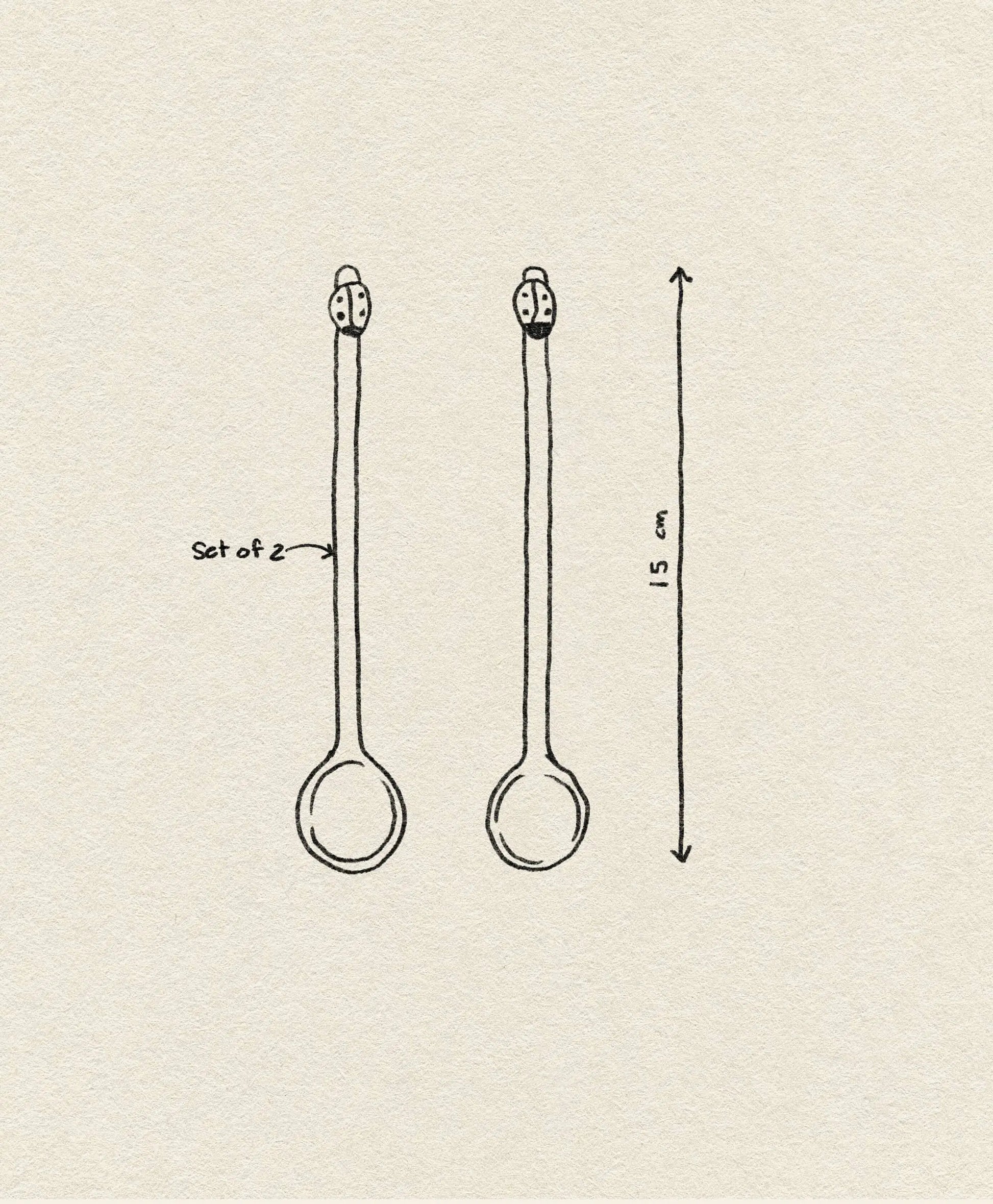 A simple line drawing shows two identical Ichendorf Milano Fruits and Flower Teaspoons, set of 2, each with a round bowl and long handle. An arrow indicates their length is 15 cm. Brand: Ichendorf Milano.