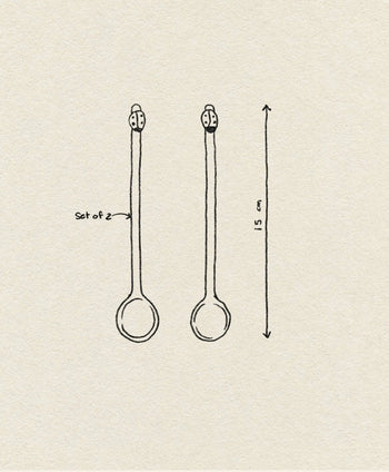 A simple line drawing shows two identical Ichendorf Milano Fruits and Flower Teaspoons, set of 2, each with a round bowl and long handle. An arrow indicates their length is 15 cm. Brand: Ichendorf Milano.