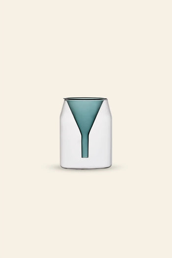 The Ichendorf Milano Kado Single Flower Vase (16cm) features a modern, minimalist white design with a teal, funnel-shaped insert, reminiscent of hand-flamed glass, shown upright against a plain beige background.