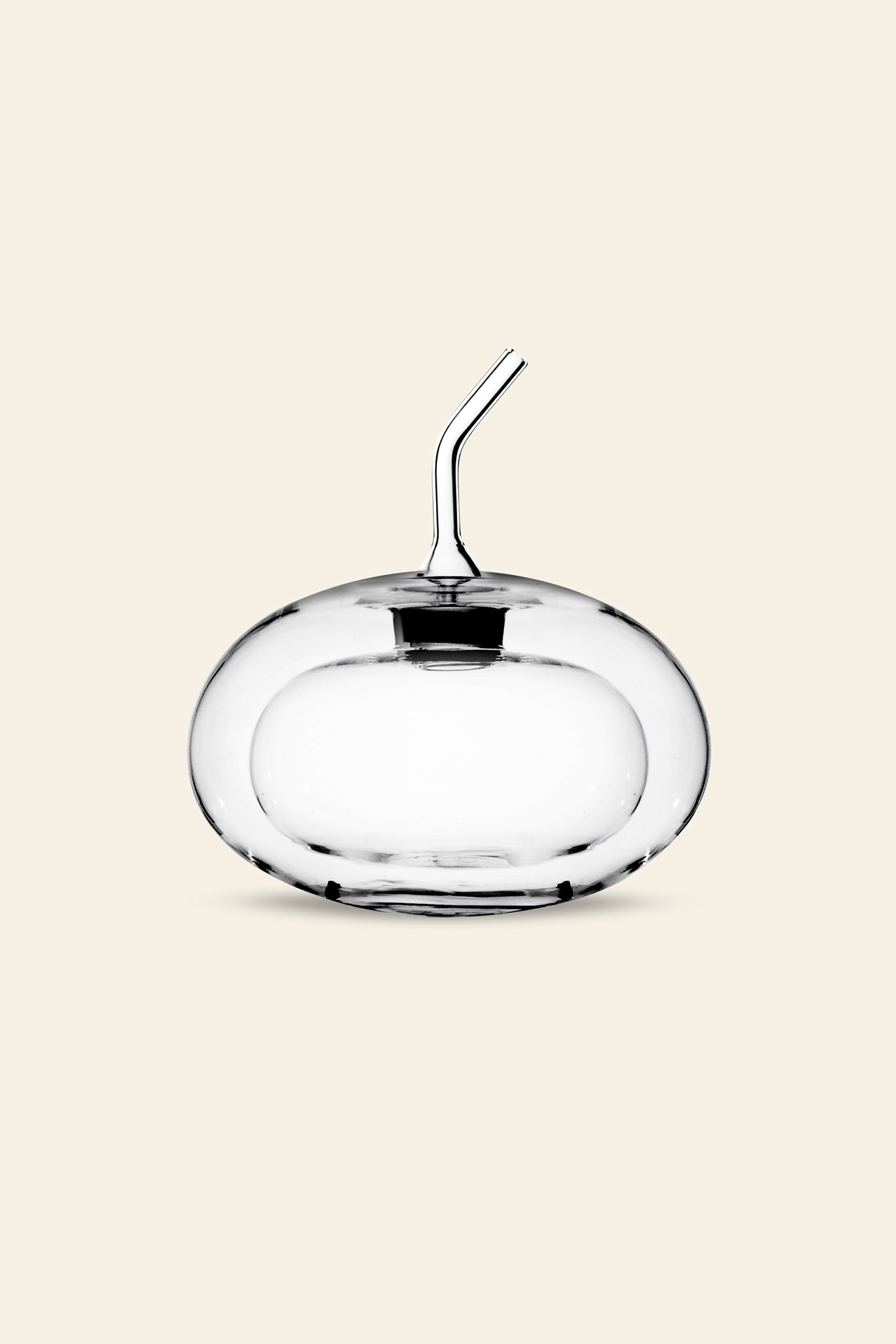 The Ichendorf Milano Sfera Doublewalled Olive Oil Bottle by Ichendorf Milano is a clear, round glass container with a spherical design and short angled spout, shown against a plain beige background.