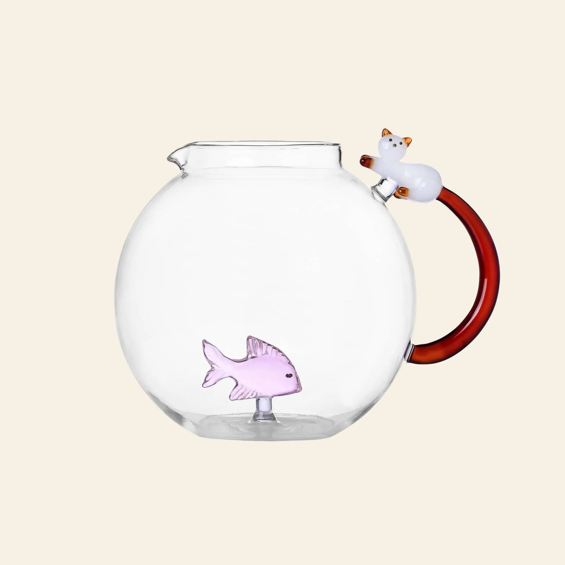 The Ichendorf Milano Tabby Cat Jug features a white cat-shaped red handle with an amber tail and a small pink glass fish inside, set against a plain light background.
