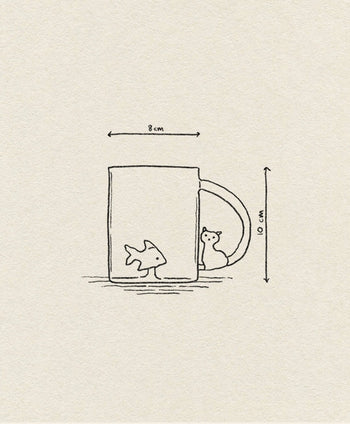 A minimalist line drawing of the Ichendorf Milano Tabby Cat Mug by Ichendorf Milano, featuring a cat figurine in the handle and a fish in the cup. The 8 cm wide, 10 cm tall mug is shown on a plain beige background.