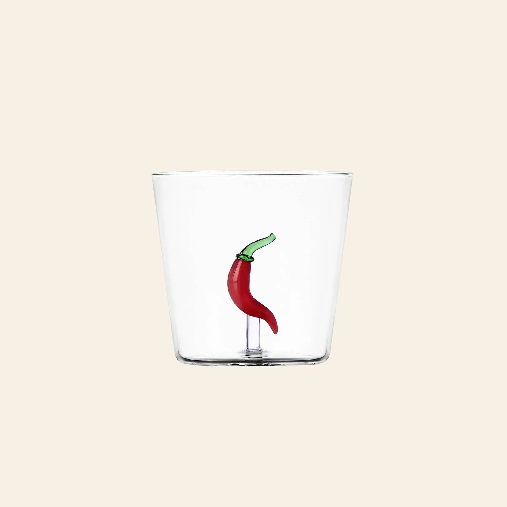 The Ichendorf Milano Vegetables Tumbler by Ichendorf Milano features a hand-blown glass design with a sculpted red chili pepper and green stem inside—an eye-catching piece for any vegetables collection.
