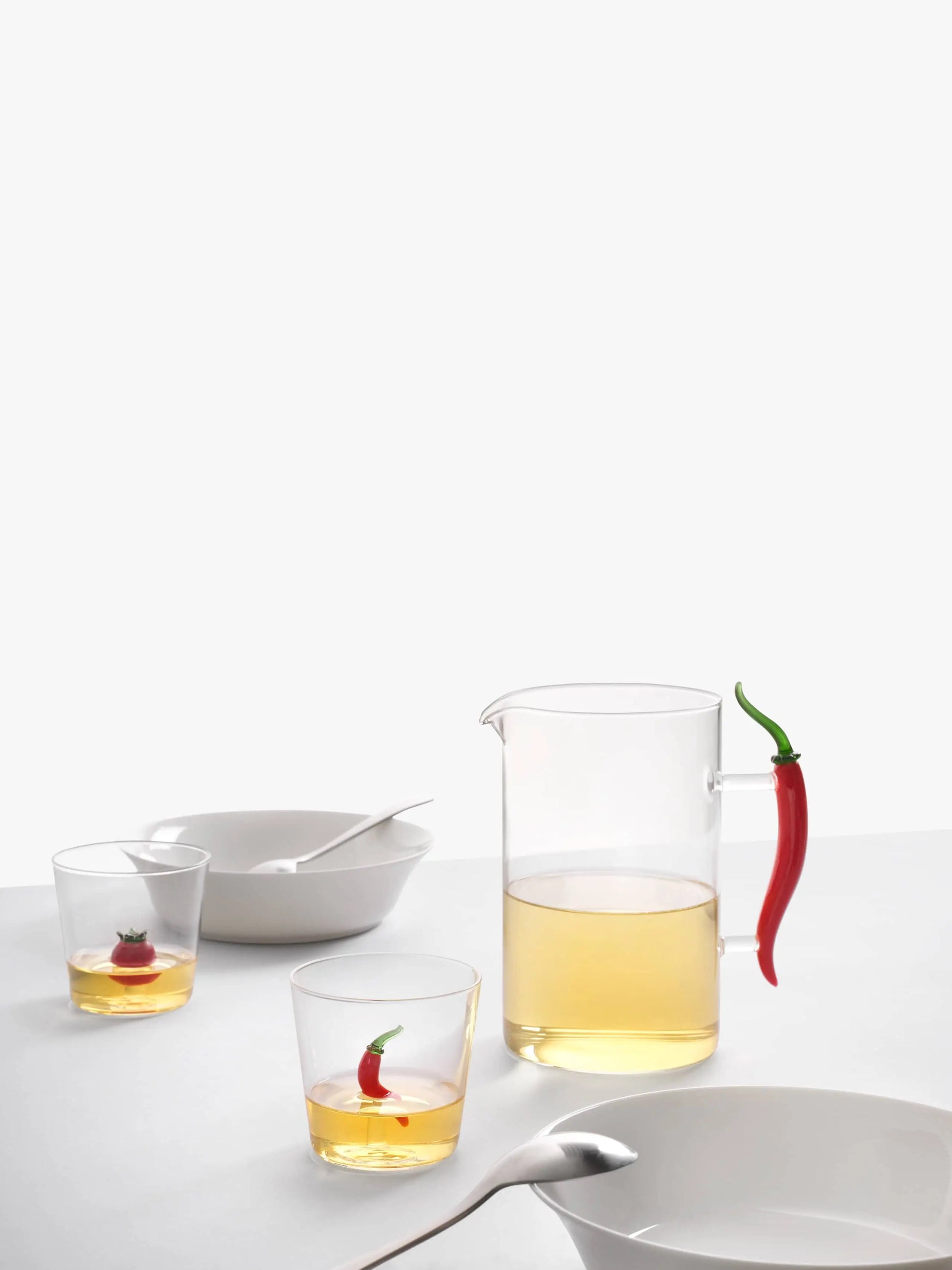 The Ichendorf Milano Vegetables Tumbler by Ichendorf Milano, featuring chili pepper-inspired details, adds a vibrant and unique touch to any minimalist table setting—a perfect gift for design lovers.