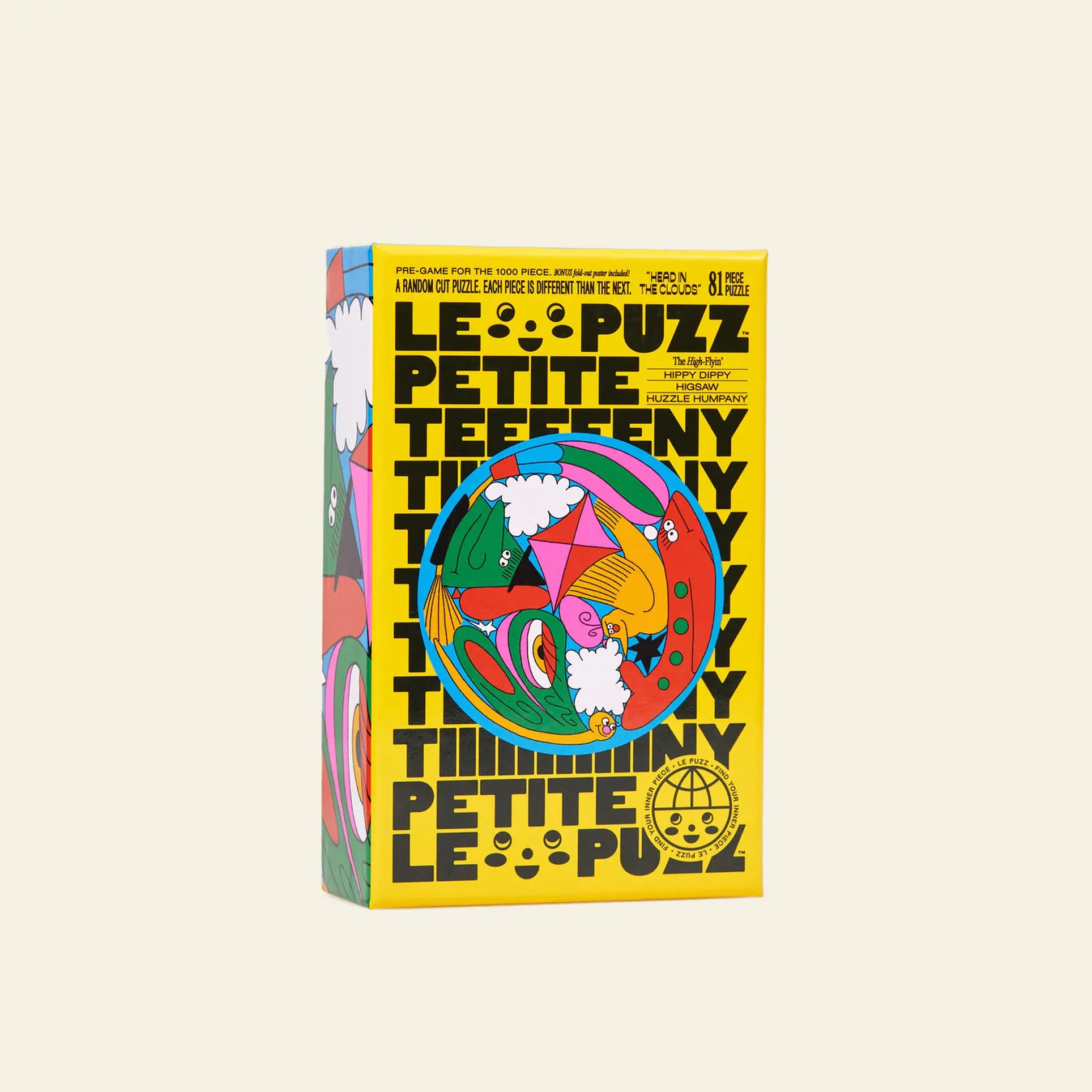 A vibrant Le Puzz Head in the Clouds 81 Piece Puzzle box by Le Puzz stands upright at an angle, displaying a bold yellow background, playful shapes, whimsical circular design, cloud graphics, and bursts of imaginative color.