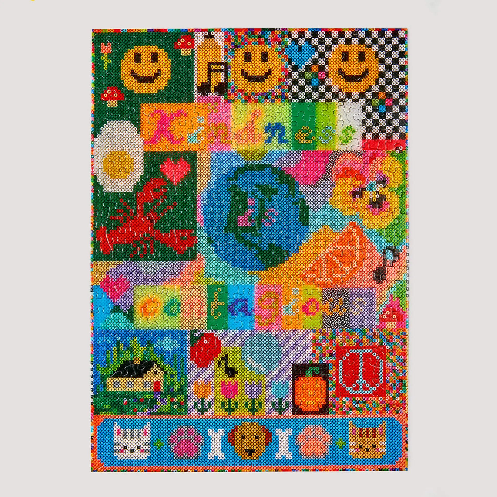 Le Puzz Kindness is Contagious 500 Piece Puzzle by Le Puzz features a vibrant collage of smiley faces, flowers, a fried egg, and cheerful patterns with “Kindness is contagious” in rainbow text across the center.