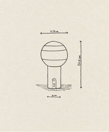 A minimalist line drawing of the Marset Dipping Light Portable by Marset, showing a colored glass sphere (12.5 cm diameter), cylindrical base (6 cm wide), and overall height of 22.2 cm—perfect for creating ambient lighting.