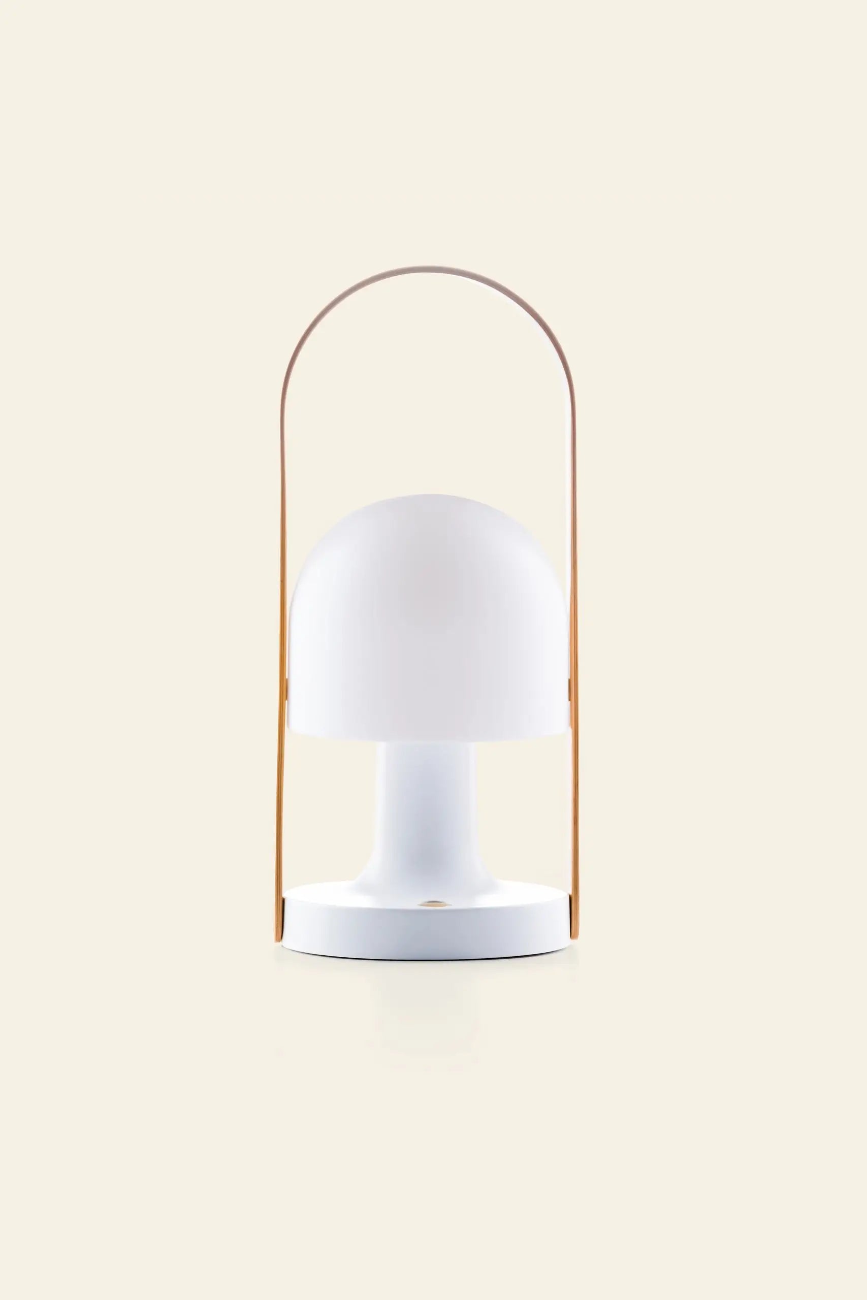 The Marset FollowMe Portable Table Lamp by Marset features a modern white design, dome-shaped shade, and curved oak handle, showcased against a plain beige background.