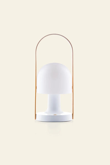 The Marset FollowMe Portable Table Lamp by Marset features a modern white design, dome-shaped shade, and curved oak handle, showcased against a plain beige background.