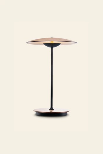 The Marset Ginger 20 M Table Lamp by Marset features a round wood base, wide shade, and slim black stem—ideal for adding a cosy touch to modern interiors.