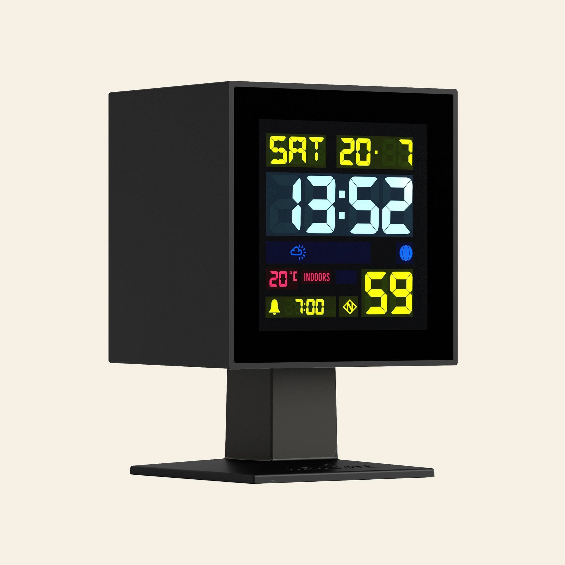 The Newgate Monolith LCD Alarm Clock by Newgate features a square display showing 13:52, Saturday, 20-7, 20°C indoor temperature, moon phase and alarm icons, weather symbols, all set on a sleek black stand.