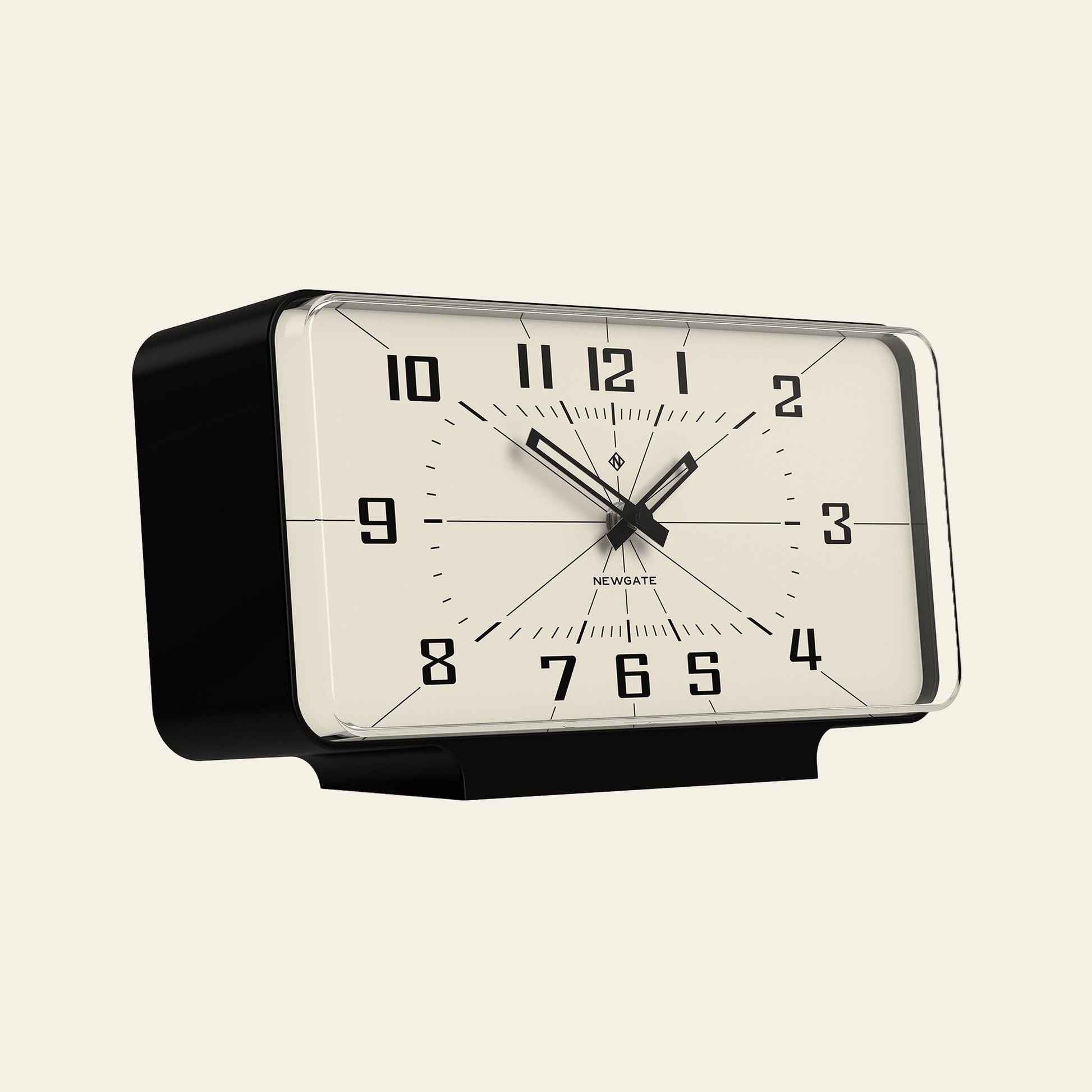 The Newgate Planet Mantel Clock by Newgate is a rectangular, vintage-style black and white clock with bold Arabic numerals and hands, shown from a slight left angle against an off-white background.