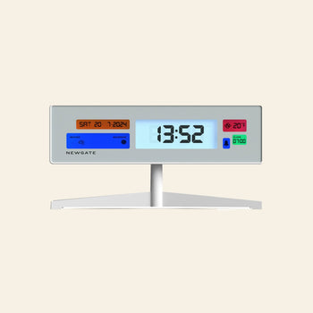 The Newgate Supergenius LCD Alarm Clock from Newgate displays 13:52, Saturday 20-7-2024, and 20°C on a vivid rectangular screen with an alarm symbol. It features a USB power cable and modern design with colored sections.