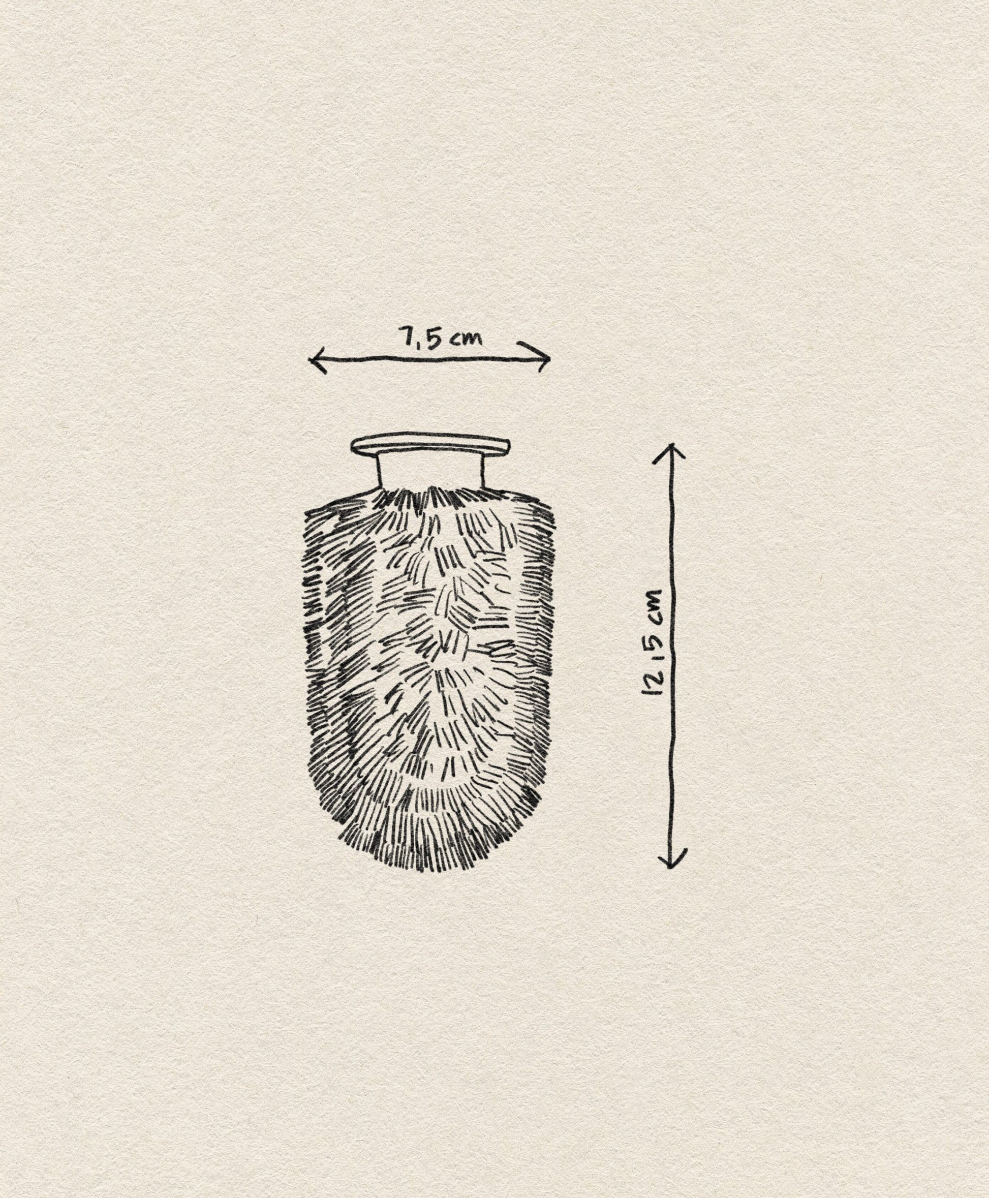 A black and white sketch of the Normann Copenhagen Ballo Brush Head by Normann Copenhagen, featuring a textured, oval shape with a narrow neck, measures 7.5 cm wide and 12.5 cm tall against a beige textured background with labeled arrows.