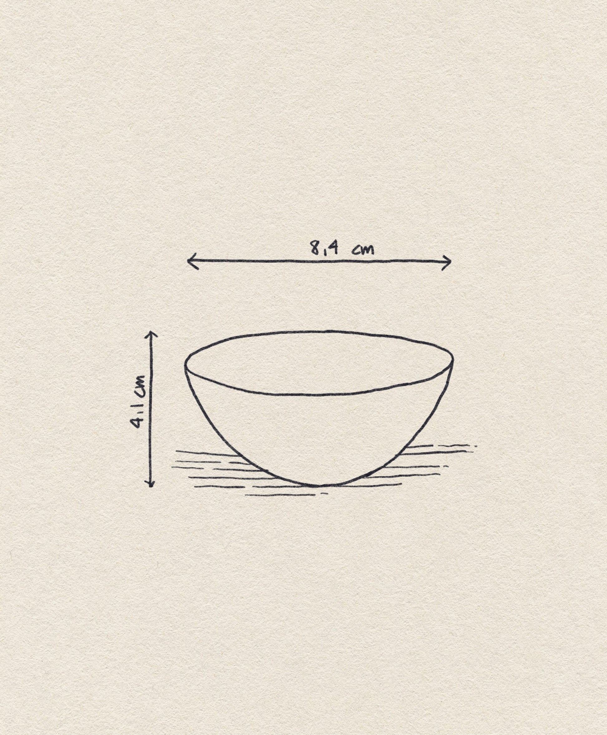 A simple sketch of the Normann Copenhagen Krenit Bowl, 8.4 cm wide, inspired by Danish design, shown with dimensions on a textured beige background.