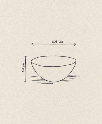 A simple sketch of the Normann Copenhagen Krenit Bowl, 8.4 cm wide, inspired by Danish design, shown with dimensions on a textured beige background.