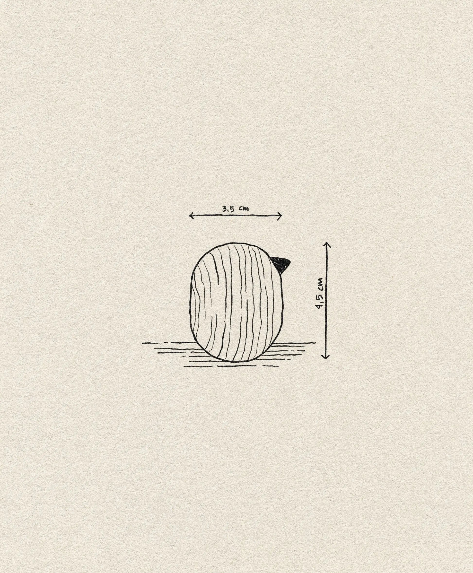 The Normann Copenhagen Little Bird (4.5 cm) is a small, round wooden bird with a short pointed tip, set against an off-white background—an ideal minimalist accent or unique decor piece from Normann Copenhagen.